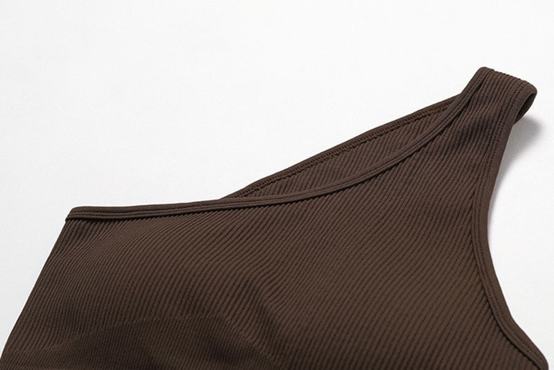 Women's one-shoulder sexy sports bra in dark brown, made of breathable nylon and spandex, ideal for fitness activities.